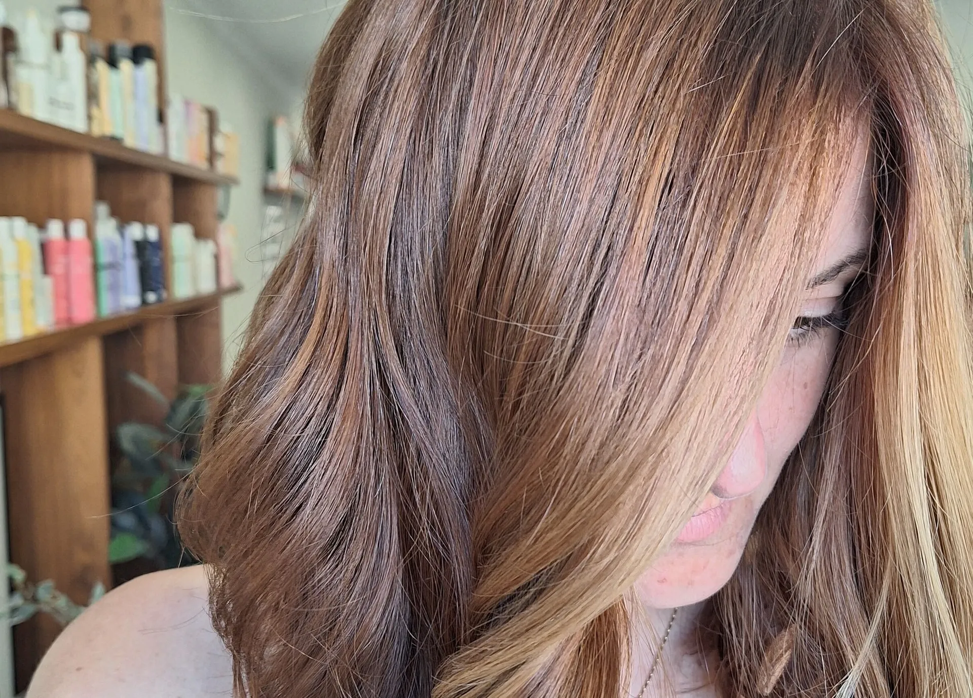Warm auburn balayage with lighter ends