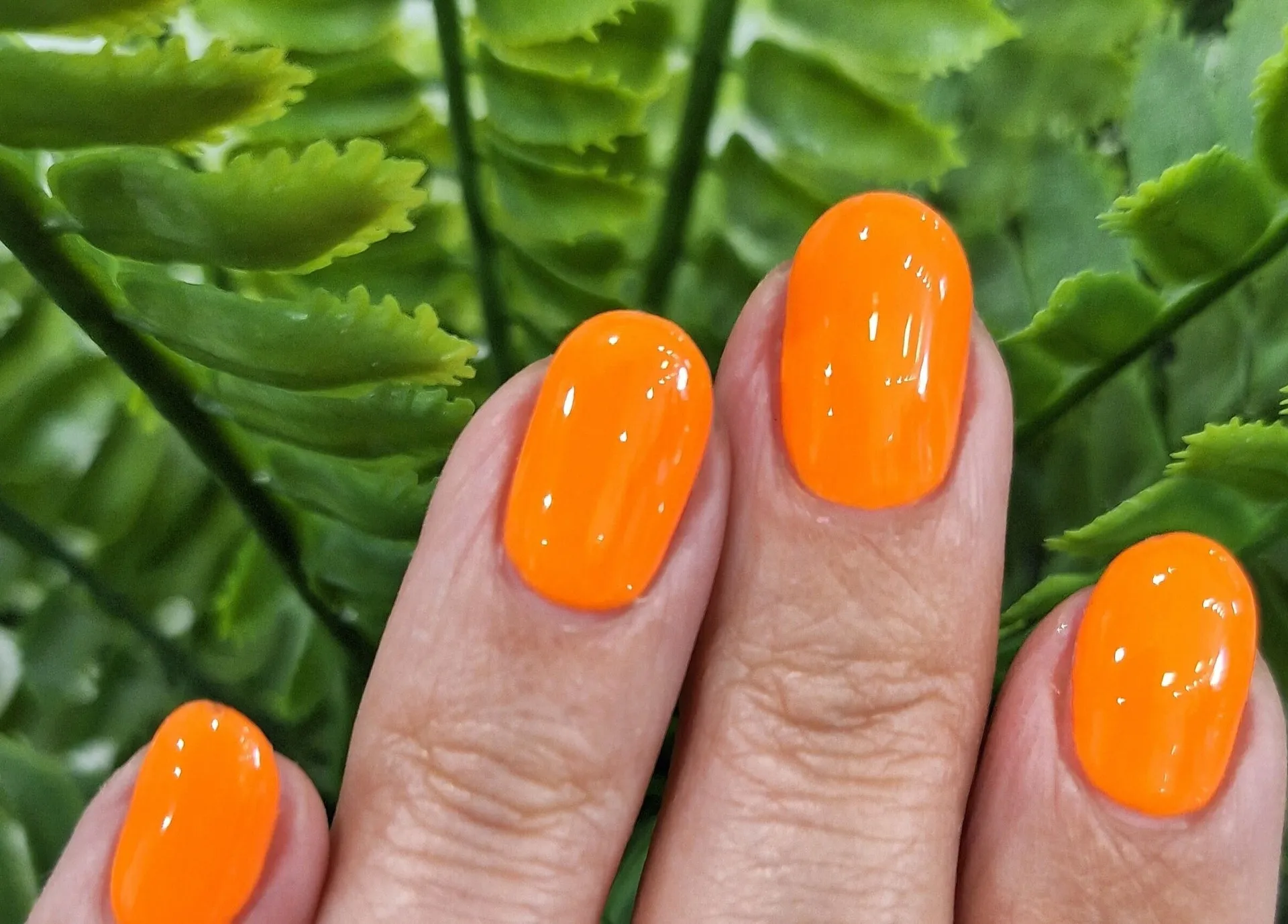 Bright orange gel polish, finished at XAR
